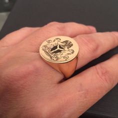 "Family Crest Engraved ring, Personalized Ring, gold ring - round seal. Engraved Signet ring with Round Seal- 18K Gold plated or sterling silver 925 - also suitable for men and women, Diameter: 2 cm = 0.78\" Please note in the \"notes to seller\" at checkout. : * state your ring size * picture / family crest you want me to engrave * Please attach in \"convo box\" the picture you want me to engrave in black and white clear lines - as high quality the pic is as good the result we get The product w Gold Signet Ring With Coat Of Arms, Formal Signet Ring With Coat Of Arms, Gift Signet Ring With Coat Of Arms, Gift Coat Of Arms Signet Ring, Classic Coat Of Arms Ring, Anniversary Signet Ring With Coat Of Arms, Anniversary Coat Of Arms Signet Ring, 14k Engraved Ring For Commemoration, Engraved Ring With Coat Of Arms As A Gift