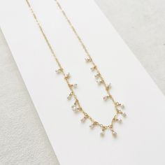 The Fringe Necklace effortlessly blends understated charm with subtle glamour, making it the perfect accessory to elevate spring and summer's open necklines. Timeless freshwater pearls cascade down a delicate chain. Adjustable for effortless style, this necklace is a wearable work of art. - 16 inches in length with a 1-inch extender - all pieces are 14K Gold Filled or Sterling Silver, for more information on our metals click HERE! The Fringe, Fringe Necklace, Freshwater Pearl Necklace, Delicate Chain, Freshwater Pearl Necklaces, Base Metal, Effortless Style, Fresh Water, Freshwater Pearls