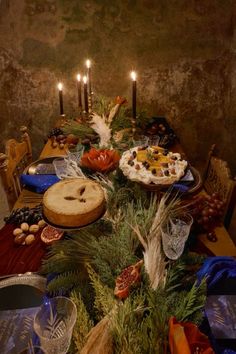 a table is set with food and candles