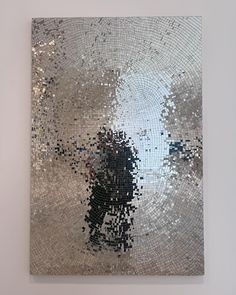 an abstract piece of art that looks like it has been made out of silver and black squares