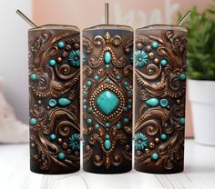 three brown and turquoise colored lighters sitting next to each other on a white table