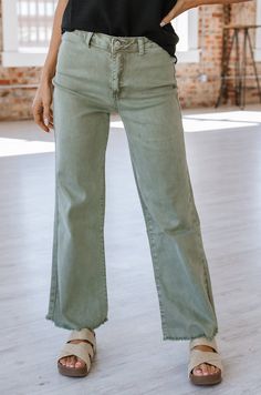 Elevate your style with our Lena Straight Wide Pants. These pants feature a flattering straight cut and a wide leg design, providing a comfortable fit and a chic look. Make a statement wherever you go with these versatile and stylish pants! Model Info: Models are 5'7", Size 2, wearing smalls Material: 97% cotton 3% spandex Trendy Stretch Wide-leg Jeans, Everyday Frayed Hem Bottoms For Fall, Frayed Hem Bottoms For Everyday Fall Wear, Frayed Hem Bottoms For Fall, Green Stretch Wide Leg Jeans, Everyday Bottoms With Frayed Hem For Fall, Everyday Fall Pants With Frayed Hem, Casual Full Length Pants With Frayed Hem, Elevated Casual Wide Leg Bottoms