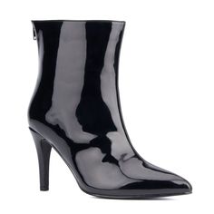 Crafted from ultra-shiny vegan patent leather, this beautiful pair of boots is perfect for any special occasion. The classic pointy toe heel is complemented by the modern back zipper closure, providing utmost convenience without compromising style. And thanks to its generous width, your feet will stay comfortable all night long. A stunning statement boot with attitude! Glossy Party Boots, Chic Glossy Finish Boots For Parties, Glossy High Heel Party Boots, Sleek Glossy Boots For Evening, Glossy Finish High Heel Party Boots, Sleek Glossy Finish Evening Boots, Elegant Glossy Evening Boots, Shiny Black Fitted Boots For Party, Fitted Shiny Black Boots For Party