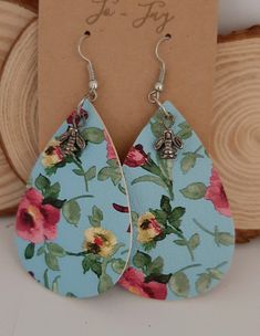 Blue floral hook earrings. Lightweight and great for any occasion or season ! Blue Dangle Earrings For Spring, Blue Dangle Flower Earrings For Spring, Spring Adjustable Teardrop Earrings, Summer Blue Teardrop Earrings As Gift, Blue Teardrop Earrings For Summer Gift, Floral Print Earrings For Gifts, Spring Gift Teardrop Dangle Earrings, Floral Print Earrings For Gift, Blue Bohemian Flower Earrings For Spring