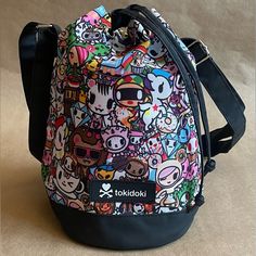 - Super Cute Tokidoki Drawstring Bucket Bag Features All Your Favorite Tokidoki Characters - Donutella, Latte, Unicorns, And More! - Pink Canvas Lining With Black Accents. - Durable, Adjustable Double Strap Allows For Longer Or Shorter Wear. - Round Bottom With A Trendy Drawstring Closure. - Approx. 7" Diameter X 10" High. - Great For Kids Or Adults. - Can Be Worn Over The Shoulder Or As A Crossbody Bag. - New Without Tags. Tokidoki Characters, Drawstring Bucket Bag, Pink Canvas, Black Accents, Crossbody Shoulder Bag, Bucket Bag, Crossbody Bag, For Kids, Super Cute