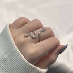 Introducing the Sparkly Snake Adjustable Ring - an alluring piece crafted from s925 sterling silver. This captivating ring features a sleek snake design adorned with sparkling accents, adding a touch of mystique and elegance. Its adjustable band ensures a perfect and comfortable fit for any finger. The Sparkly Snake Adjustable Ring is a stunning addition to any jewelry collection, embodying both charm and sophistication. Snake Accessories Jewelry, Silver Snake Jewelry, Snake Ring Aesthetic, Snake Jewelry Necklaces, Snakes Jewelry, Snake Jewelry Ring, Snake Accessories, White Masquerade Mask, White Masquerade