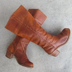 70s DEXTER sienna brown leather campus boots with leather soles and wood heels. Made in USA Label size 7 M Please compare measurements to a similar style boot that fits you well 9-5/8" when measured with heel against wall 3-1/2" at ball of foot, measured across sole 16-3/4" from floor to top  15-3/4" circumference at calf  2-1/2" block heels Good vintage condition with light wear to heels and soles. Some spots, darkening on the outward facing part of the left boot, as readily visible in photos. Campus Boots, Wood Heels, Womens Booties, 2 Block, Booties Ankle Boots, Wood Heel, Leather Block Heels, Dexter, Boot Shoes Women