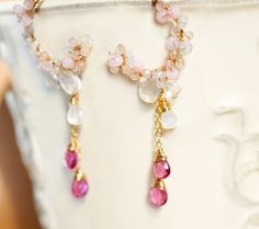 The Pink Gemstone Chandelier Earrings are designed to make a statement on your special occasion or wedding day. Made with a fusion of delicate pink and milky white gemstones and intricate details that exude an air of romance and sophistication. ● Material    14k gold filled or Sterling silver 20gauge ( Post 0.8mm thick ) ● Gemstone     Pink tourmaline rubellite teardrops approx 5mm x 6mm  (Pink tourmaline distribution volume is decreasing year by year. with slightly natural internal cracks( it's Wedding Chandelier Earrings With Gemstone Accents, Wedding Dangle Chandelier Earrings With Gemstone Accents, Pink Gemstone Jewelry For Weddings, Pink Gemstone Accented Jewelry For Weddings, Pink Gemstone Accent Jewelry For Weddings, Pink Gemstone-accented Jewelry For Weddings, Pink Gemstone Wedding Earrings, Pink Gemstone Earrings For Wedding, Pink Gemstone Accented Earrings For Weddings