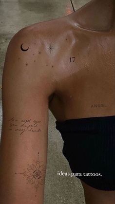 the back of a woman's arm with tattoos on it and an inscription that reads,