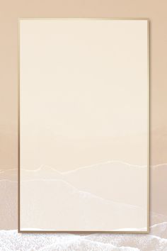 a white square frame on top of a beige background with waves in the ocean below