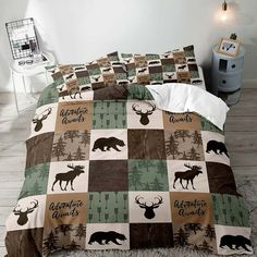 the comforter is made up with moose and pine trees on it's side