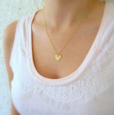 "A Minimalist handmade gold-filled or sterling silver necklace with a tiny heart charm, layered pendant necklace. This necklace is made from high-quality 14K gold filled. Unlike gold plating, the gold in gold-filled jewelry is mechanically bonded to the base metal, and it will not wear off or turn black. It is light and classic, perfect for everyday use. You can wear it as a single, minimalist necklace or layered with more necklaces for a total boho look. Get this basic necklace - you just can't Dainty Small Heart Necklace For Everyday, Dainty Heart Pendant Charm Necklace For Everyday, Dainty Everyday Heart Pendant Charm Necklace, Simple Everyday Charm Necklace With Heart, Simple Everyday Heart Charm Necklace, Minimalist Handmade Heart Necklace For Everyday, Everyday Minimalist Handmade Heart Necklace, Delicate Heart Pendant Charm Necklaces, Simple Heart Pendant Necklace For Everyday