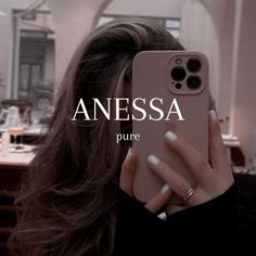 a woman taking a selfie with her phone in front of her face and the words anessa on it