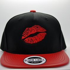 Hat Details: - Flat Embroidery of Red Lips Design - 5 Panel Hat  - Adjustable Standard Snapback Enclosure - Wide Brim Design - Black Crown - Red Faux Leather Brim - Red Faux Leather Top Button Artist Hat, Star Vinyl, Faux Leather Top, 5 Panel Hat, Black Crown, Embroidered Hat, Lip Designs, Panel Hat, Leather Hats