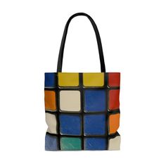 a multicolored tote bag is shown on a white background with black handles