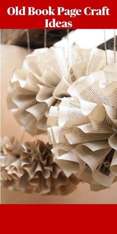 an old book page craft idea with paper flowers hanging from it's sides and text overlay that reads, old book page craft ideas