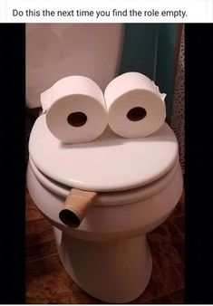 two rolls of toilet paper sitting on top of a white toilet seat with the caption do this next time you find the role empty