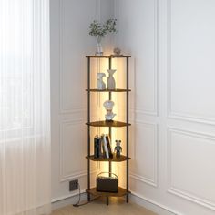 a corner shelf with books and vases on it next to a window in a white room