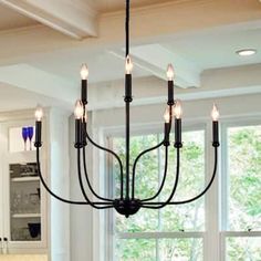 a chandelier hanging from the ceiling in a kitchen