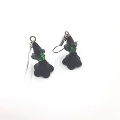 These witch earrings are a must-have accessory for any lover of the dark and magical. Handmade with 4mm black beaded pieces, green bead head, and silver ear-wire, these earrings are a simple yet stylish addition to any Halloween outfit. Whether you're attending a party or just looking to add some spooky flair to your everyday look, these earrings are a perfect choice. Don't miss out on this must-have accessory for the season of the witch! 🪄 Free shipping on all orders $35 or above 🪄 Each piece Witchy Drop Earrings, Black Single Earring For Halloween, Nickel-free Black Spooky Earrings, Spooky Black Drop Earrings, Green Halloween Party Earrings, Witchy Black Nickel-free Earrings, Green Halloween Dangle Earrings, The Season Of The Witch, Beautiful Birthday Cards