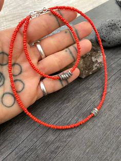 A unique set of dainty seed bead choker and bracelet. A minimalist cottagecore style jewelry made with orange earth tone seed bead, and in the middle unique sterling silver beads with tiny hand stamped plants details on them. This sterling silver beads are spinning beads and they have sterling silver hook clasp. You can choose to buy either just the bracelet just the choker or get both to have a unique set. This are perfect for layering with other accessories and perfectly statement pieces to we Orange Round Beads Jewelry For Everyday, Everyday Colorful Beads Orange Jewelry, Everyday Orange Round Bead Jewelry, Adjustable Orange Choker Jewelry, Adjustable Coral Jewelry With Tiny Beads, Handmade Orange Necklace For Everyday, Everyday Spiritual Orange Jewelry, Adjustable Orange Necklace With Spacer Beads, Handmade Orange Heishi Beads Jewelry