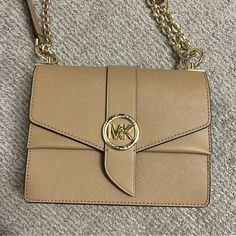 Brand New Michael Kors Small Greenwich Crossbody In Color Camel. It's The Perfect Tan Nude Neutral Basic Color. This Style Still Retails At Full Price For $300 On The Mk Website. Can Be Worn As A Crossbody And Shoulder Bag. No Flaws Beige Flap Bag With Gold-tone Hardware, Beige Flap Shoulder Bag With Branded Hardware, Beige Shoulder Flap Bag With Branded Hardware, Michael Kors Beige Bag With Detachable Strap, Michael Kors Beige Top Handle Shoulder Bag, Michael Kors Beige Crossbody Bag, Michael Kors Beige Crossbody Shoulder Bag, Michael Kors Beige Shoulder Bag With Gold-tone Hardware, Michael Kors Beige Evening Bag