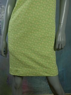 This 1960s Swedish vintage shift dress has a delicate yellow floral pattern on a mint green background. The sleeveless slip-on dress has a square bateau neckline and a green polyester lining. Bust = 37 inches (93.98cm) Waist = 37 inches (93.98cm) Hips = 37 inches (93.98cm) Dress Length = 35.5 inches (90.17cm) Brand label: Ajco (Made in Sweden) Size: 6/8 US/UK Material: Diolen Polyester Condition: Excellent (clean, soft, and supple, with no stains, tears, wear spots, or weaknesses in the seams) - Green Spring Dress With Straight Neckline, Green Square Neck Dress For Daywear, Vintage Light Green Dress For Spring, Green Stretch Dresses With Square Neck, Green Stretch Square Neck Dresses, Green Square Neck Stretch Dresses, Green Square Neck Daywear Dress, Vintage Green Square Neck Dress, Retro Green Square Neck Dress