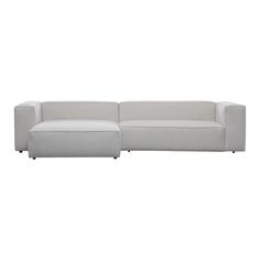 a white couch sitting on top of a white floor