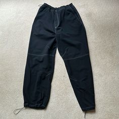 Large Baggy Black Zara Parachute Pants, With Adjustable Bottoms And Waist Draw String, Size: Large, Men’s. Never Worn Black Stretch Cargo Pants With Tapered Leg, Black Stretch Cargo Trousers, Black Stretch Tapered Leg Pants, Stretch Black Cargo Pants, Black Stretch Techwear Parachute Pants, Black Techwear Sweatpants For Spring, Black Sporty Bottoms With Contrast Stitching, Black Techwear Ankle-length Bottoms, Black Techwear Ankle-length Pants