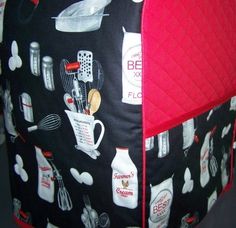 a black and red oven mitt with cooking utensils on it