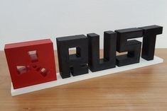 RUST game logo with text and support. Perfect gift for any Rust player and fan. Made on a 3D printer with PLA material. Painted with acrylic and coated with glossy varnish. If you want the text in white and the base in another color, you just have to ask for it. Fully customizable upon request. A perfect gift for any fan of the game rust. Choose your color: - Unpainted: completely white or black logo - Painted: Square logo in red, RUST letters in white or black depending on the chosen color. Approximate size: 220 x 50 x 15mm Rust Game, Pastel Home Decor, Square Logo, Pastel House, Game Logo, Gaming Gifts, Black Logo, 3d Printer, Hanging Signs