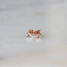 Stunning rose cut diamonds shine from modern prong settings in these gorgeous earrings. This is solid 14k gold, recycled and refined in the U.S. The diamonds are .15 carats each (3.5mm), 1/3 carat total weight, SI1, G-H color, and 100% conflict-free. The studs come with 14k gold tension backs, as pictured. You can choose from 14k yellow or 14k rose gold. A rose-cut diamond has a flat base and a crown made up of triangular facets that are symmetrically arranged and rise to form a point at the top Gold Diamond Earrings Studs, Stud Earrings Gold, Large Ring, Diamond Stud Earrings, Diamond Stud, 3 Carat, Simple Earrings, Rose Cut Diamond, Gorgeous Earrings