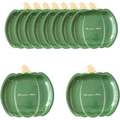 six green pumpkin plates stacked on top of each other