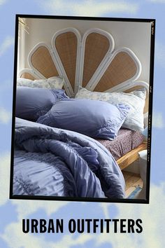 an image of a bed with blue comforter and pillows on it that says urban outfitters