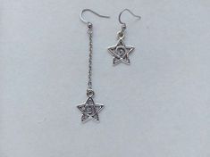 The earrings are adorned with a small star-shaped pendant. The earrings are fastened with stainless steel hookss. Earring length - 7.0 cm (2.7 inches) Earrings are packed in a gift box RECOMMENDATIONS FOR CARE: Do not wet, do not drop, and store in a dark box! - Remove jewelry before exercising, swimming, showering and sleeping. - Avoid contact with moisture such as make-up, moisturizer, lotion, perfume and hairspray. - Store your jewelry in a box or pouch after use. Girlfriend Earrings, Earrings Y2k, Earrings Gothic, Silver Star Earrings, Gothic Earrings, Spiral Earrings, Handmade Wire Jewelry, Rock Stars, Support Handmade