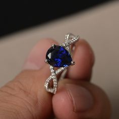 This is a gorgeous handmade creation. Its beauty is its simplicity & Elegance. The 7*9 mm pear shape faceted lab sapphire is crafted in solid sterling silver and with rhodium plated. All item is sent in a beautiful gift box If you have any idea of design your ring,pls contact me directly. You can realize more lovely stuff clicking the link https://www.etsy.com/shop/knightjewelry?refshopsection_shophome_leftnav Please leave the correct address and you phone number for delivering successfully. Fine Jewelry Pear-shaped Sapphire Ring, Pear-shaped Sapphire Ring, Blue Pear-shaped Sapphire Ring, Blue Sapphire Pear-shaped Ring, Pear-shaped Lab-created Sapphire Jewelry, Blue Pear-shaped Sapphire Ring With Accent Stones, Pear-shaped Blue Sapphire Ring, Teardrop Sapphire Ring With Diamond For Gift, Fine Jewelry Sapphire Ring With Pear Shape