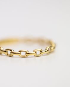 14k Solid Oval Link Ring Crafted from 14-karat yellow gold, this timeless piece features open oval links, lending a delicate, chain-like aesthetic to any stack of rings. Perfect for elevating any look with an effortless touch of elegance. Material: 14k Yellow Gold Width: 2.2mm Gold Oval Stackable Rings, Tarnish Resistant, Gold Oval Stackable Rings Tarnish Resistant, 14k Gold Oval Jewelry With Gold Chain, Adjustable Link Chain Ring In Yellow Gold, Timeless Gold Oval Stackable Rings, Gold Oval Link Chain Ring, Tarnish Resistant Gold Oval Link Chain Ring, Tarnish Resistant Oval Stackable Rings In Fine Jewelry, Elegant Oval Stackable Rings For Everyday