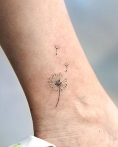 Dandelion Tattoo Micro Dandelion Tattoo, Elegance Tattoo For Women, Dandelion Tiny Tattoo, Nature Related Tattoos, Aesthetic Dainty Tattoos, Dandelion Wish Tattoo, Wishing Flower Tattoo, Minimalist Dandelion Tattoo, Matching Dandelion Tattoo