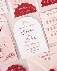 the wedding stationery is laid out on top of each other, including envelopes and cards