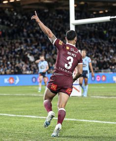 a rugby player is running with the ball