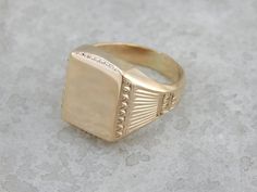 Stately Style Vintage Gold Signet Ring NNYX0L Classic Gold Diamond Ring With Decorative Band, Classic Yellow Gold Rectangular Jewelry, Classic Rectangular Yellow Gold Jewelry, Timeless Gold Diamond Cut Signet Ring, Timeless Gold Signet Ring With Diamond Cut, Gold Diamond Cut Signet Ring, Gold 14k Signet Ring With Polished Edges, Gold Signet Ring With Polished Edges In 14k Gold, 14k Gold Signet Ring With Polished Edges