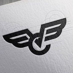 the letter f is made up of two black and white wings on top of each other