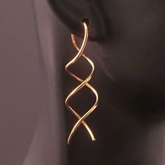 Rose Gold Earrings / Twisted Spiral Dangle Earrings / Uniquely Different - A MetalRocks Original Design    One of my most popular designs, I decided to offer these earrings in 14K Rose Gold Fill although they are available in 14K Yellow Gold Fill as well.  Should you desire Yellow, please put your request in the Message to Seller upon checkout. These are made from 18G 14K Rose Gold Fill which is slightly thicker than 20g the standard North American ear wire size.  Should you have new or tight pi Spiral Wire Wrapped Earrings For Party, Wire Wrapped Spiral Earrings For Parties, Party Spiral Wire Wrapped Earrings, Spiral Earrings With A Modern Twist, Spiral Single Earring For Party, Rose Gold Spiral Earrings With Ear Wire, Rose Gold Spiral Nickel-free Earrings, Popular Designs, Rose Gold Earrings