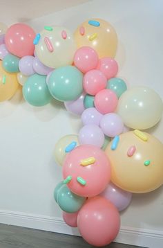 a bunch of balloons that are on the wall