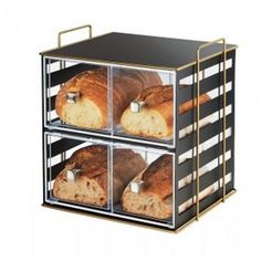 three trays with bread in them on a white background