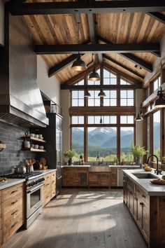 a kitchen with wooden floors and large windows overlooking the mountain range is shown in this image