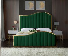 a bed with green velvet headboard and foot board in front of a large window