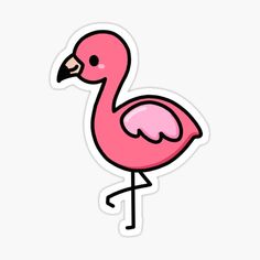 a pink flamingo sticker sitting on top of a white surface