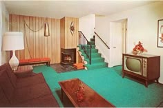 a living room filled with furniture and a fire place in front of a tv mounted on a wall