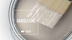 a paint can with a brush in it and the words gravellestone painted on it